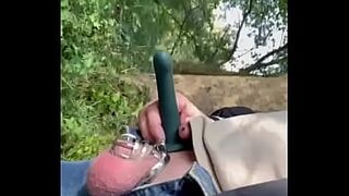 Walking in forest with ballgag, dildo and chastity